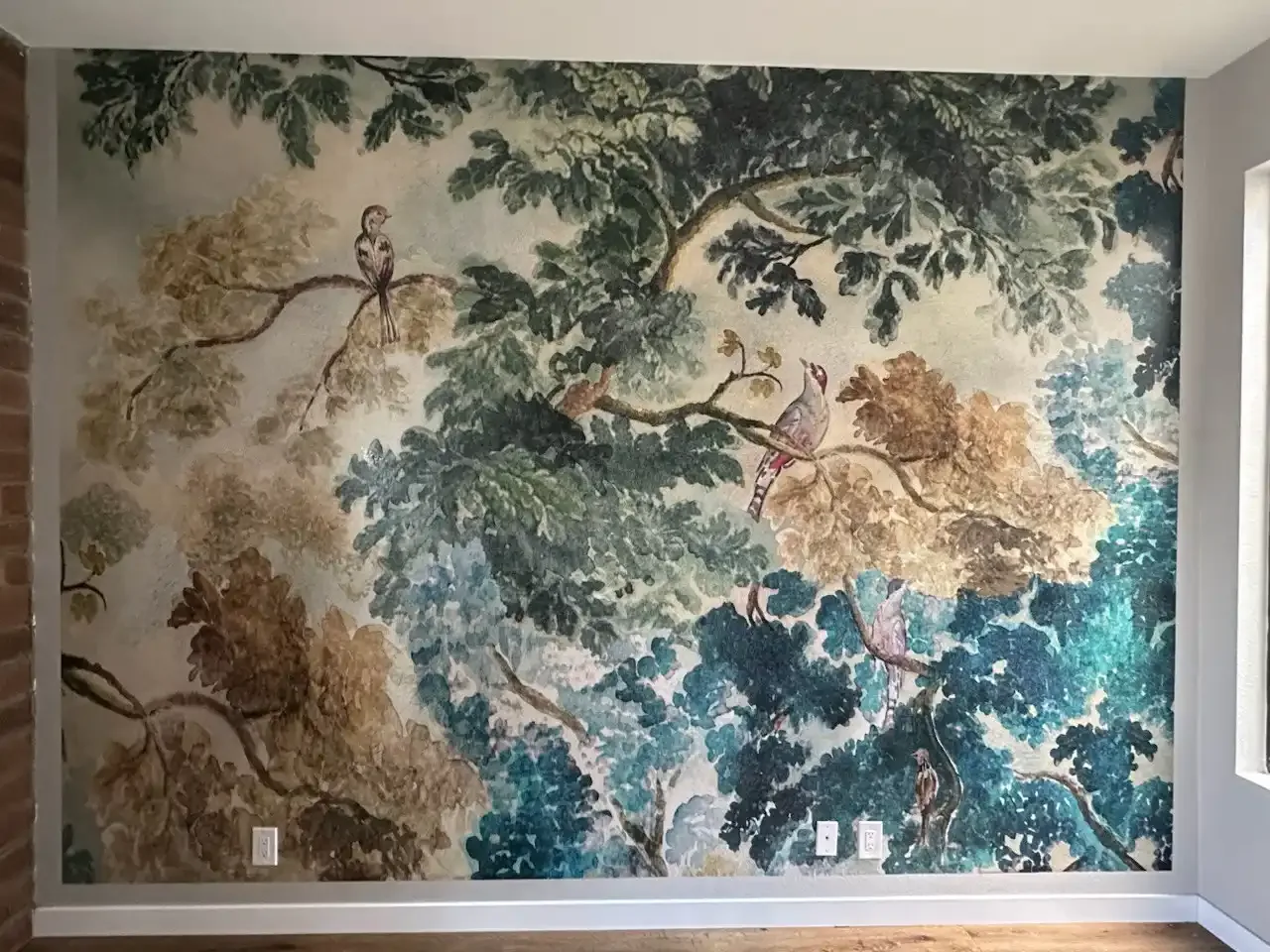 A large decorative wall mural spanning a finished interior wall